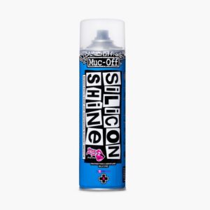 Aerosol azul Muc-Off Silicon Shine sobre fondo claro